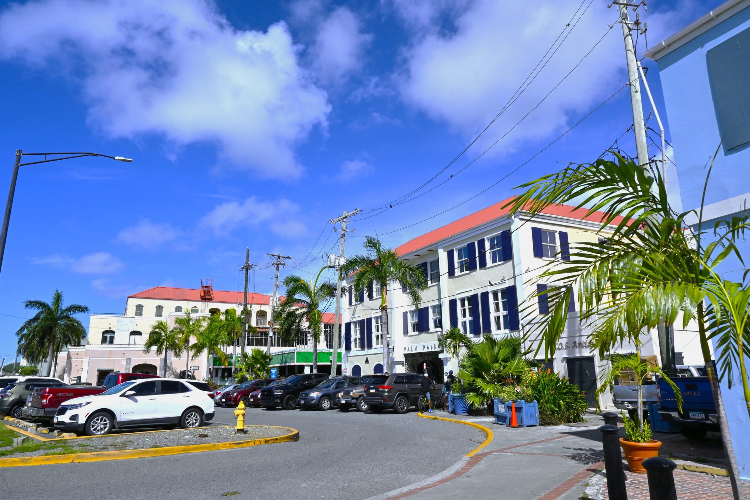 Exterior of Palm Passage with International Plaza and Greenhouse Restaurant in the background on the sunny day with blue skies